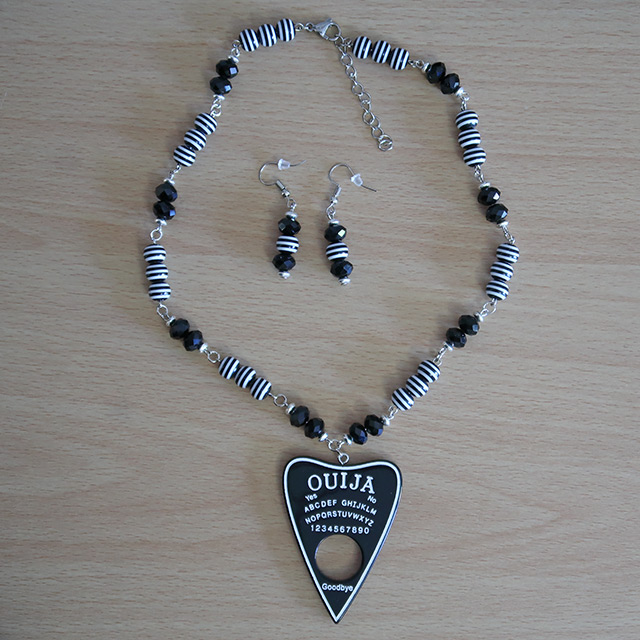 Ouija Planchette necklace and earrings (overhead view)