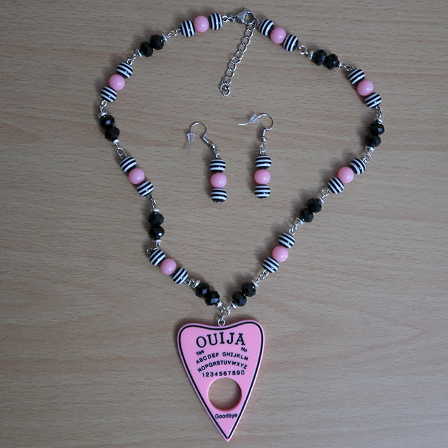 Ouija Planchette necklace and earrings (overhead view)