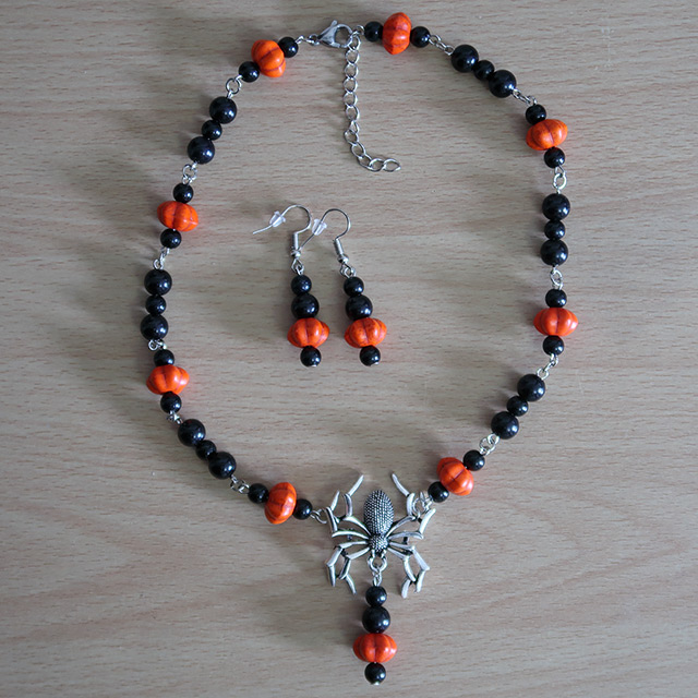 Spider necklace and earrings (overhead view)