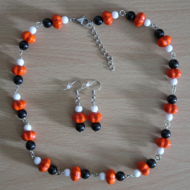 Pumpkin necklace and earrings (overhead view)