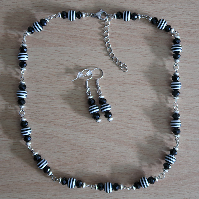 Striped necklace and earrings (overhead view)